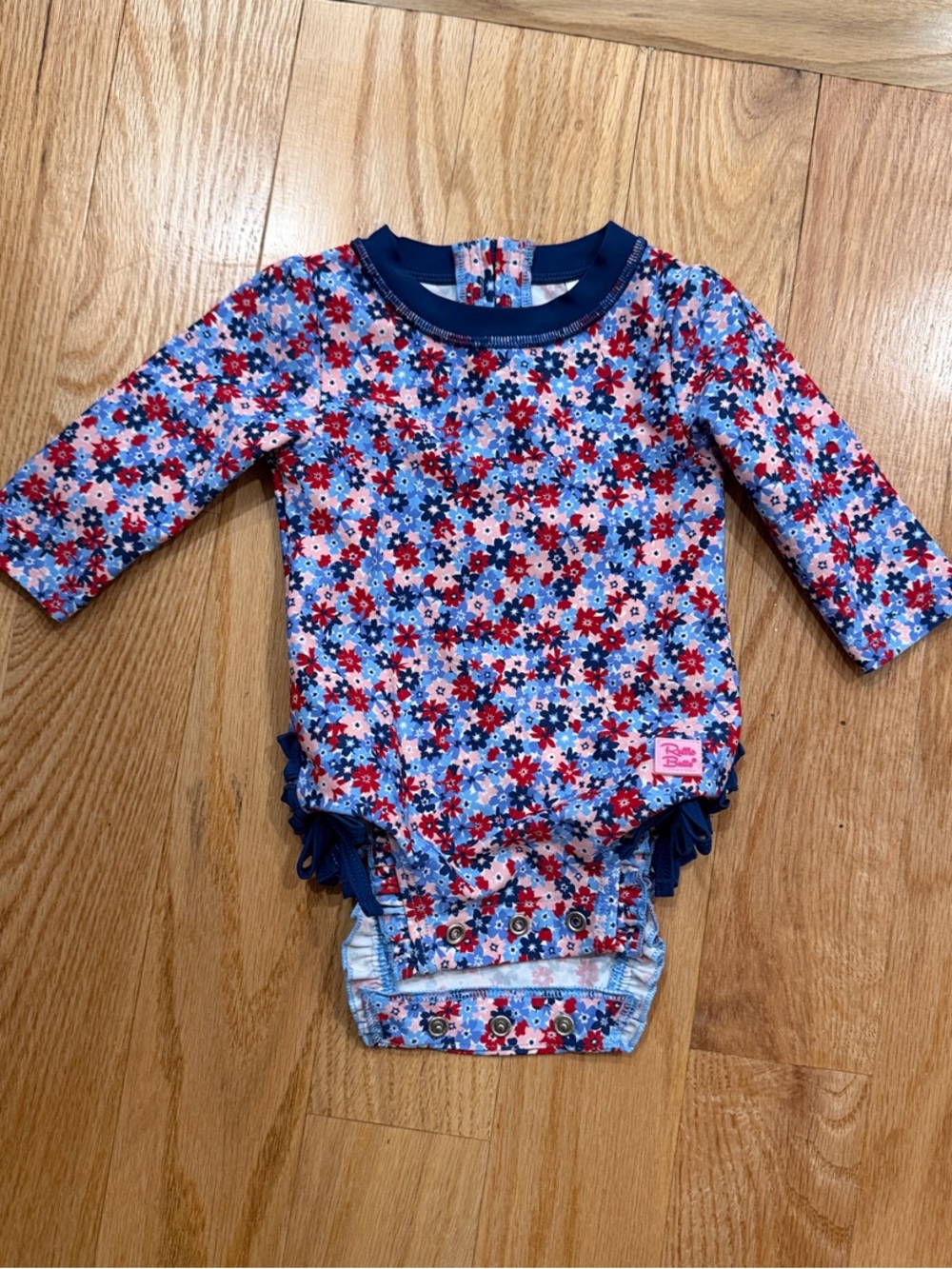 Rufflebutts Floral Long Sleeve Baby Swimsuit in Red, Blue & White, size 3-6mo